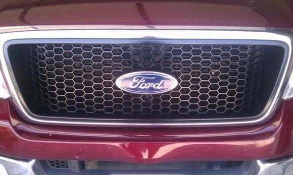 Newly painted gloss black grill.