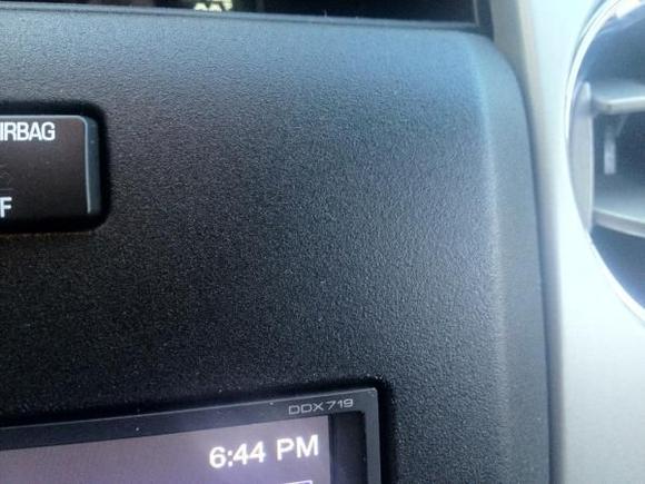 Scosche bezel painted with Rustoleum black textured spray paint.