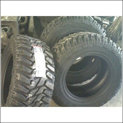 Cooper Discoverer STT's 305/60/R18. I like em, i like em a looot!!!! mean lookin! and whisper quiet!