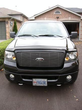 FX4 lower valance painted and reinstalled. Along with my old black tow hooks now freshly chromed. I like this look better!