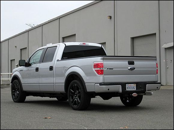 Lowered with 2wd F150 stock strut/springs and 2" shackles in the rear with 22" F150 Limited wheels powdercoated black.