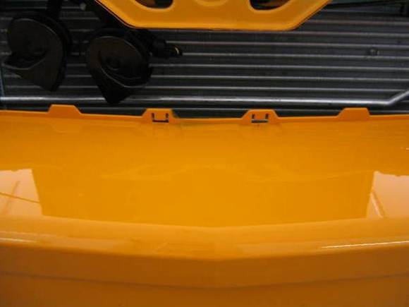 Note the exposed mounting slots for the factory grille.