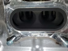All that black area is going to get hogged out.  The membrane there between pistons 2 and 3, and between each valve will be thinned and polished.  On pistons 1 and 4, CarbonTek reports there is hidden water channels to avoid when porting.  Hopefully my cylinder head porter will know what to do...