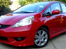 My new Fit. Unadorned at this time. Car bling is coming.