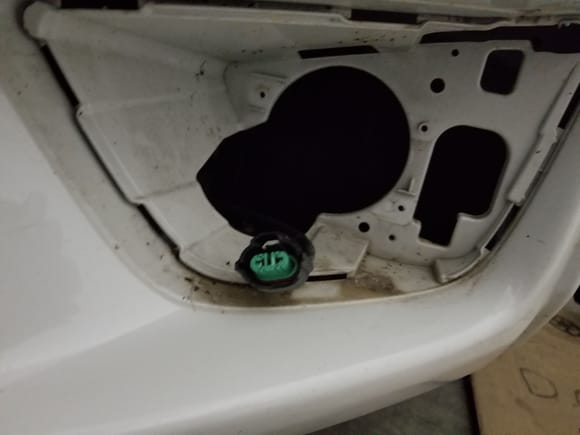 Just remove 1 screw from the fender well and get rid of that resonator. Then you can push the tabs in on the black housing. Then remove the connector and two screws on the fog light. 