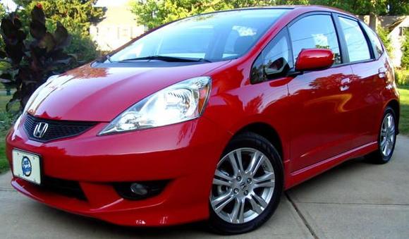 My new Fit. Unadorned at this time. Car bling is coming.