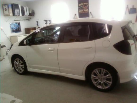 Tinted windows, blacked out taillights, black shark fin, vent visor kit, aftermarket wheels are otw.