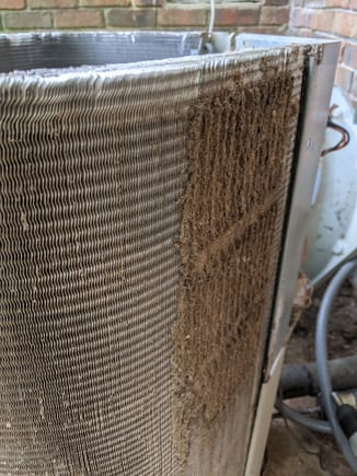 I cleaned the bulk off with a fresh-filtered shop vac and a careful hand, then did a final cleaning with the coil cleaner. I can't speak to how the cleaner itself handles a large bulk of packed dust.