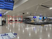 Left luggage at far end of baggage claim