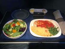 Pre-landing snack. Grilled chicken, green beans, and couscous.