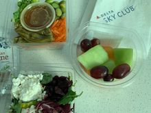 Salads, sandwiches, wraps, yogurt, fruit & cheese, and a separate sweets section (cookies, brownies)