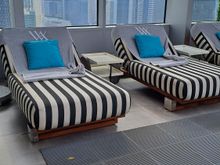 Pool side loungers on 17th floor pool deck