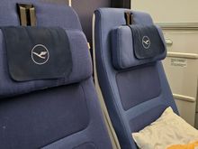 Seat in upright position. Recline can be measured against the thickness of the curtain 