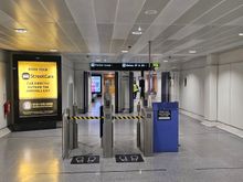 Newer biometric gates down the stairs before gate 37