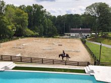 My cousin riding her newest horse and teaching him to jump. His racing name was News Item.