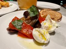 Buffalo mozzarella with marinated eggplant and roast tomatoes.