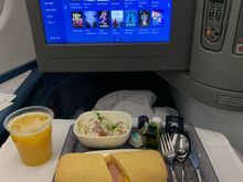 No change with pre-arrival meal: choice of hot ham and cheese sandwich with salad or cold grilled chicken salad with potato salad side