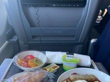 Fruit plate, croissant, turkey sausage with omelette and yogurt with a cookie. 226 mile flight. 