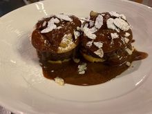 Close up of the melting chocolate profiteroles 