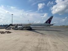 Four Qatar planes on the ground, including this one