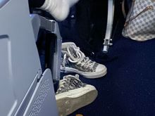 Landing - video screen out, bag not under seat and shoes sitting means no free egress