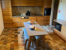 Self catering kitchen, a bit dark, down some stairs in the Centaure cottage at the Domaine des Etangs.