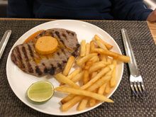 Black Angus minute steak with chipotle butter, lime and fries