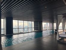 The pool seemed to be warmed! Has cabanas and a smaller warmer kids pool on the further end. Could order from the Conservatory menu as well. 