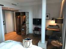 The pillar is in the middle of the room, yet there is still space to maneuver