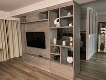 Executive Suite; TV cabinet somewhat separates the living area and bedroom. 