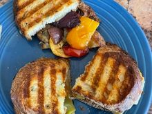 I used leftover balsamic roasted veggies from the Super Bowl and sharp white cheddar and made paninis with olive oil rosemary bread. Pretty tasty. 