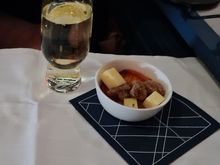 Amuse; cheese, a fig and honey/sugar ?? roasted nuts