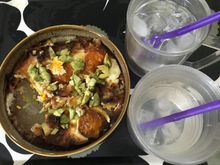 With coconut water from a tree in the garden