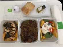 Left to right: miso barbecue chicken, braised beef and black bean rice, grilled peach and burrata salad