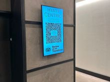 Giant screen in the first-floor entry lobby soliciting TripAdvisor reports