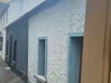The tour goes down some very narrow streets, where these row houses front. 