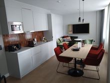 One bedroomsuite with large  kitchen and table 