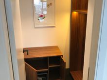 Extra coatroom next to wetbar, has a standard safe
