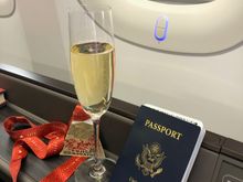 Predeparture champagne, but not Krug. One unexpected thing for me about the seat was the windowshade function. By pressing the button below the window, a soft screen and then a darker opaque screen came down over the windows, a much more elegant presentation than normal window shades. It's the first time I've seen anything like it, and I may or may not have spent a few minutes just drawing the blinds up and down!