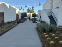 An example of the nicely landscaped paths around the second floor. Rooms on the right side include some walk-up rooms on the third floor.