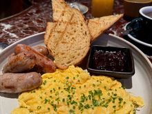 Eggs on sourdough with sausages breakfast at Bang