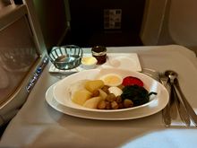 BA2230 BKK-LGW 2nd meal breakfast: half a chicken breast, a hard boiled egg, boiled potatoes, straw mushrooms, spinach, and half a tomato. Bit of a random selection but ok albeit bland. Crew found me a spare butter and jam portion so I at least enjoyed the GF bread.