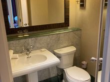 Opposite of the closet is a second toilet, still orginal design