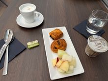 My guesthouse in Milan did not offer breakfast (plus I had to leave there around 6:30am for the 50km train ride to MXP), so I planned to eat at the lounge. Very so-so lounge and food, it would have scored a few more points had the yogurt not been practically as thin as whole milk. There was no granola but I ended up dumping some cocoa rice puff cereal in to make it edible.