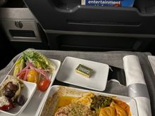 No pre-order when the upgrade clears a few hours before! I believe the on board options presented were Chicken Parmesan or... a pasta? I normally can remember but I was very tired. I noticed the Centennial Beef Wellington must have been on pre-order and several passengers had chosen it - it looked like they were enjoying it as well?