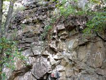 Some parts of the natural rockface are used by climbing teams