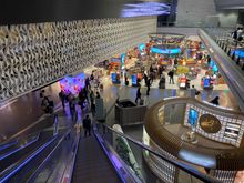 Taking the escalator to the Al Mourjan lounge