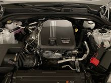 Engine - the engine seems to be placed behind the front wheel as it is a RWD-biased car. 