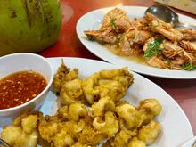With shrimp, and deep fried squid, plus steamed rice.