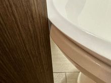 Toilet seat would move when door is closed/opened 